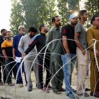 Voters stand in queue at Budgam. Sanna Irshad Mattoo/Reuters