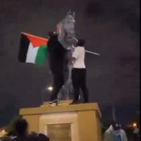 Palestinian protestors atop the statue of Maharaja Ranjit Singh