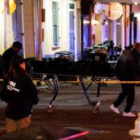 Police carry a dead body from the site. Pic: Eduardo Munoz/Reuters