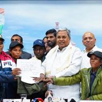 Six Maoists surrender before Karnataka CM Siddaramaiah and deputy CM DK Shivakumar/ANI Photo