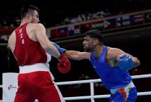 Gutsy Satish Kumar goes down to World champ Jalolov