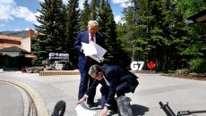 Why Is Britain's PM At Trump's Feet?