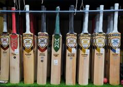 What forced MCC to change law on laminated bats?