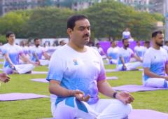 In pix: Adani, Sitharaman strike a yoga pose