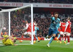 PICS: Arsenal stage late escape, but title hopes hit