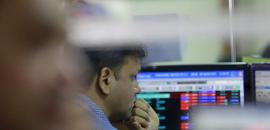 Stock markets end flat in highly volatile trade