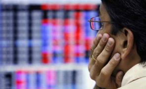 Stock markets end lower in volatile trade