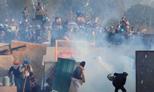 Haryana police fire tear gas as farmers head to Delhi