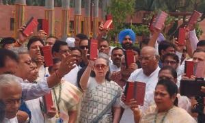 Oppn protests in Parl with Constitution copies in hands