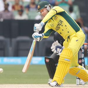Clarke scores half-century on return as Australia rout UAE