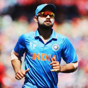 Kohli keeps wickets to give Dhoni a one-over break