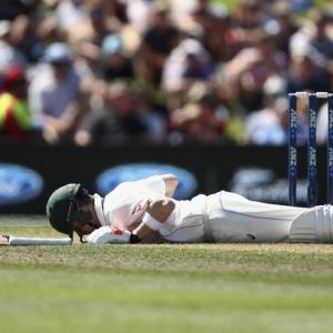 Smith earns praise after battling head knock to hit century