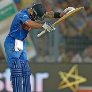 PHOTOS: Kohli bows before 'God of cricket'
