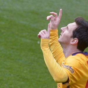 Messi double keeps Barcelona's record rolling