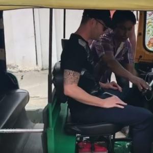 Michael Clark learns to drive 'tuk tuk' in Bengaluru