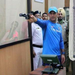 First Look: Dhoni goes shooting after practice washed out