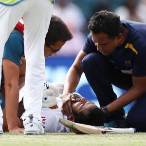 PIX: Australia strike late after Karunaratne is hit by bouncer