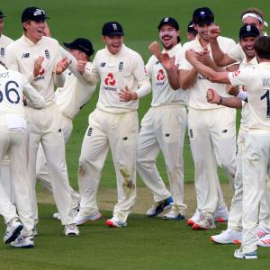 PHOTOS: Bowlers put England on top on rain-hit Day 1