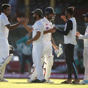 PIX: India bat through final day to snatch draw at SCG