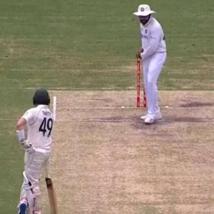 Rohit shadow bats as Smith watches