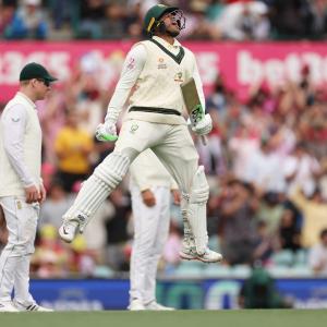 Rain leaves Khawaja stranded on 195, Aus in command