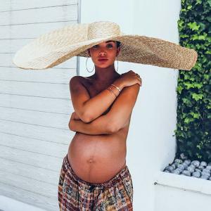 Amy Jackson goes topless, flaunts her baby bump