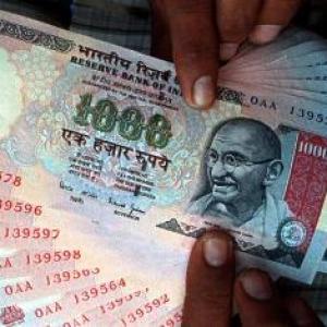 Rupee ends 3 paise lower at 63.58 against dollar