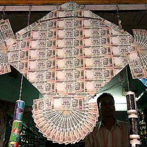 Rupee slips 10 paise to 67.26 on dollar demand