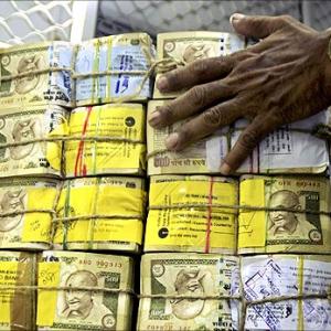 Rupee breaks below 67 against dollar, plunges 23 paise