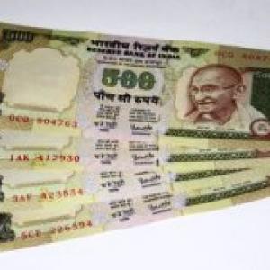 Rupee weakens by 48 paise to close at 54.97