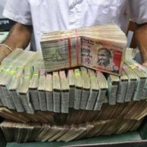 Rupee down 38 paise against dollar in late morning trade