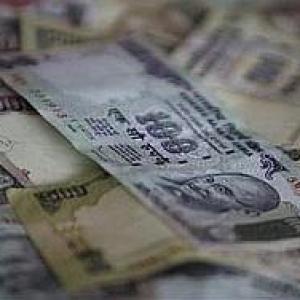 Rupee at two-week low, slumps 35 paise