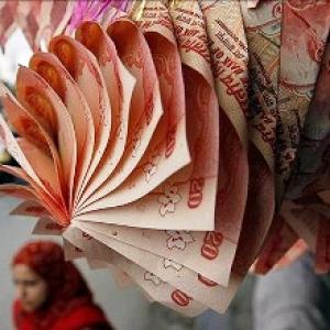 Rupee down 40 paise against dollar in early trade