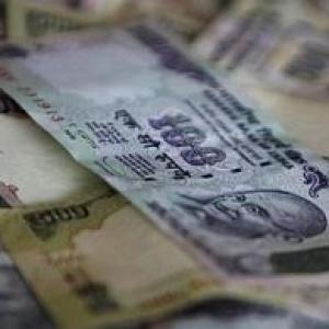 Rupee hits all-time low, ends below 60 versus dollar