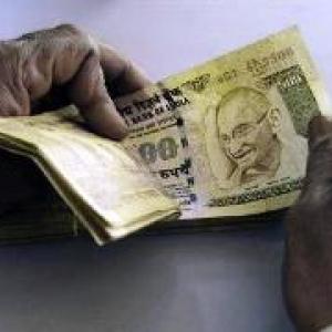 Rupee ends at over 1-month low, down 8 paise