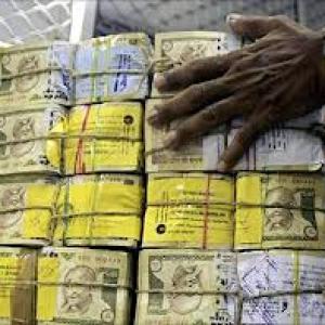 Rupee trims initial losses vs dollar; still down by 20 paise