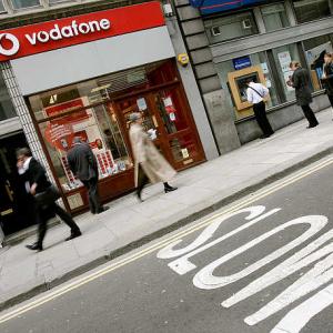 FM offers interest, penalty waiver to Vodafone, Cairn