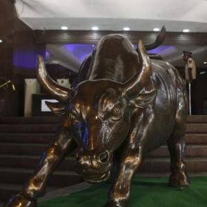 Sensex ends up 100 points, auto shares gain