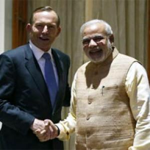 Modi and Abbott target free trade pact, sign 5 deals
