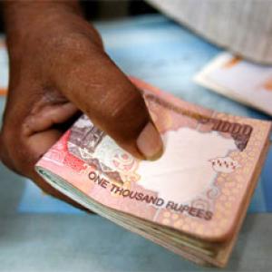 Rupee hurt by month-end dollar demand