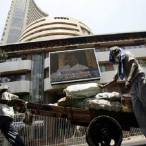 Sensex ends volatile session in red; RBI policy eyed