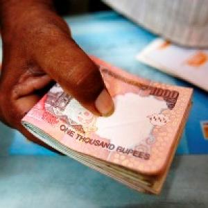 Rupee ends up 2 paise against dollar at 61.69