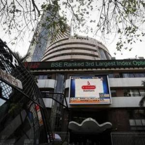 Sensex, Nifty in green; real estate slips, IT gains