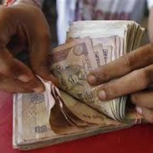 Rupee down 5 paise against dollar