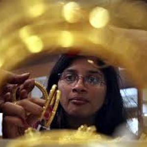 Gold weakens on sluggish demand; silver strengthens