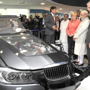 A day after biz meet in Delhi, Modi, Merkel visit Bosch facility