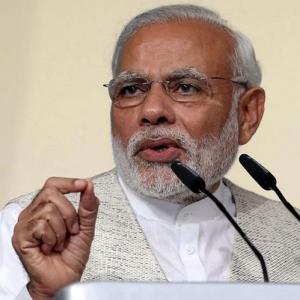 Modi says India won't join forex devaluation race to boost trade