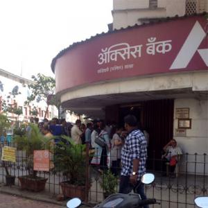 IN PIX: People throng banks as they reopen on Thursday