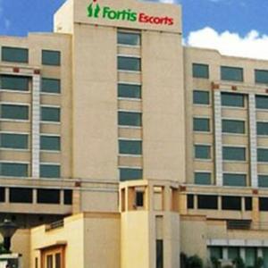 Fortis shareholders vote out director, shadow over sale