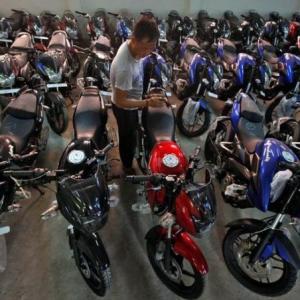 Motorcycles vroom past scooters on strong rural demand